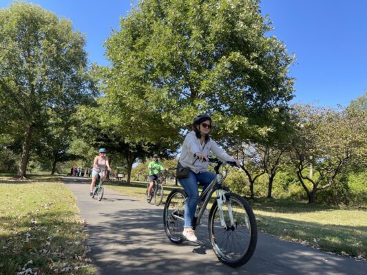 Women riding bikes on greenway
