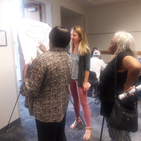 CATS staff discuss proposed bus route changes with residents during public meetings.