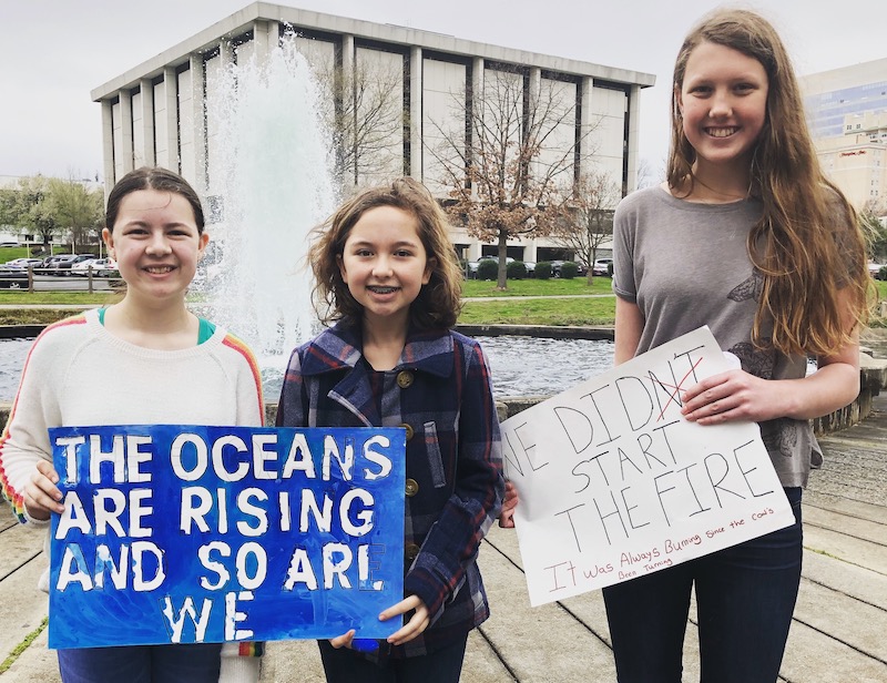 Students with climate posters 3
