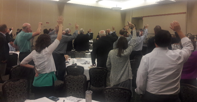 Summit attendees raised their hands to express support for transit expansion! 