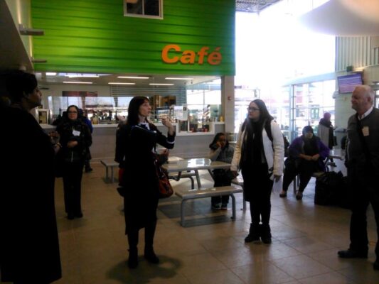 Metro staff speak near cafe