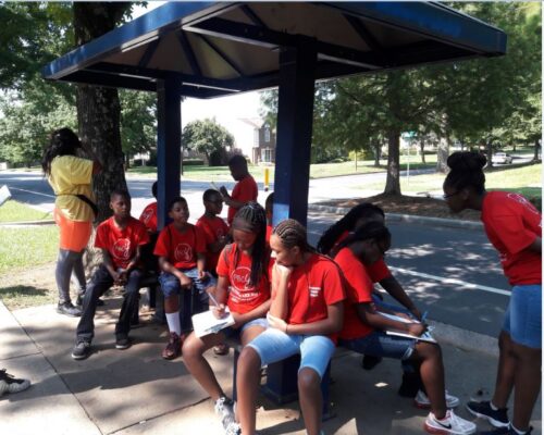 YouthQuake PBC summer program at bus stop