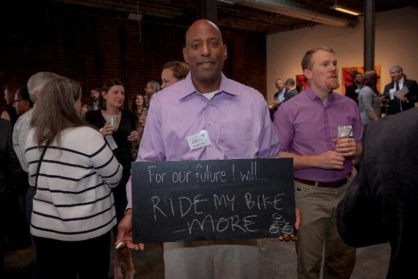 guest holding Chalkboard sign